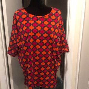 Beautiful lularue high low top. The orange and deep red with teal colors glow.